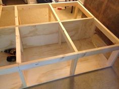 an unfinished kitchen cabinet with tools in it