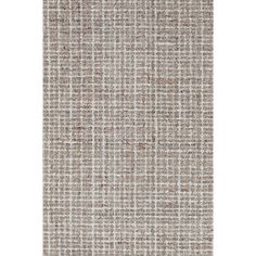 a beige and white rug with small squares on the bottom, in an area that looks like it has been made out of wool