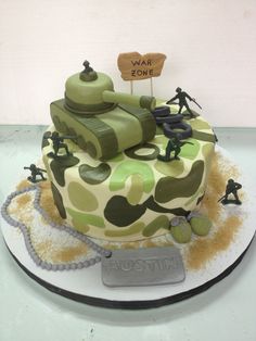 a camouflaged cake is sitting on a plate