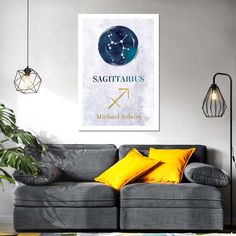 the zodiac sign sagittaris hangs above a gray couch