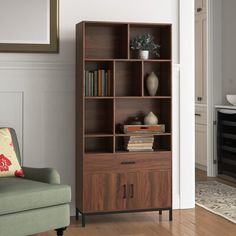 a living room filled with furniture and a book shelf next to a chair in front of a fireplace