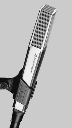 a black and white photo of a hair dryer on a gray background with clippings