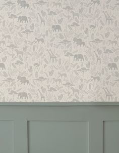 the wall paper has animals on it and is in shades of green, white, and grey