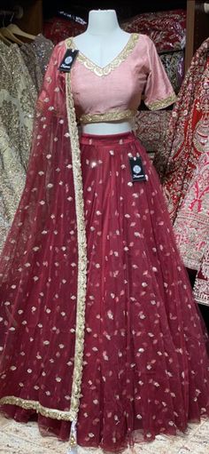 Crimson red sequence work lehenga with contrasting blush pink blouse and net dupatta. Fabric: Net This outfit can be customized in multiple colors and specific to client measurements. 90 days of production time is required and are for bulk orders only! Orders are processed in store only! Final fittings/alterations not included. Minimum Order Quantity- 4 pieces Festive Net Lehenga For Wedding, Festive Wedding Lehenga In Net, Red Party Anarkali Set With Dori Work, Pink Net Lehenga For Wedding, Red Sequined Anarkali Set For Party, Festive Red Organza Lehenga, Red Lehenga With Sequins In Traditional Drape, Red Lehenga With Sequins And Traditional Drape, Designer Red Organza Lehenga