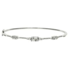 Art Deco Inspired 18ct White Gold 1.00ct Diamond Bangle Illuminate your wrist with the sheer elegance of our 18ct White Gold Diamond Bangle, a luxurious blend of sophistication and sparkle. This exquisite bangle features an intricate combination of claw-set baguette and round brilliant cut diamonds, meticulously arranged to maximize their dazzling effect. Crafted in lustrous 18ct white gold, this hinged bangle offers both stunning beauty and practical ease of wear, making it perfect for any occa Diamond Bangle, Hinged Bangle, Art Deco Inspired, Baguette Diamond, Inspiration Art, Round Brilliant Cut Diamond, Memorable Gifts, White Gold Diamonds, Round Brilliant