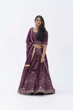 Plum Purple mirror work lehenga choli Matched with Purple mirror work blouse with quarter sleeves. Designed with round neck and has back hooks. Set together with a matching soft net purple duppata with mirror work and have gold border The length of the blouse is 14 inches. Blouse can fit a size 32 to 42 The maximum length of the lehenga will be 41 inches. Slight variation in color is possible due to digital photography. This is a 3 piece set. Care: dry clean only We provide side fitting/sleeves Purple Dupatta With Dori Work For Navratri, Festive Purple Choli With Resham Embroidery, Purple Choli With Zari Work For Eid, Purple Chanderi Choli For Reception, Purple Dola Silk Lehenga For Eid, Festive Purple Lehenga With Resham Embroidery, Eid Purple Choli With Zari Work, Purple Dola Silk Choli For Eid, Navratri Purple Choli With Resham Embroidery