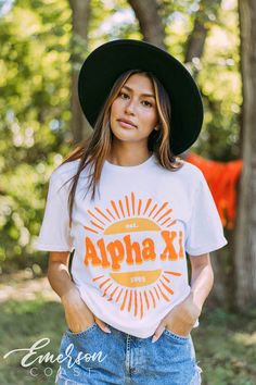 Looking for a trendy sorority tshirt that'll last? 🫶🏻 This Alpha Xi Delta Sunshine Tee is the answer! Whether you're giving this tee as a gift or treating yourself with something new, you'll be obsessed with this sorority t-shirt! 🌊 YOU'LL LOVE THIS STYLE 🌊 Meet the Alpha Xi Delta Sunshine Tee - the perfect t-shirt for sorority girls! Our basic tee is a classic style that looks great on everyone. The soft, breathable fabric makes it comfortable to wear all day long, and the bright white colo Game Day Summer T-shirt With Screen Print, Summer Game Day T-shirt With Screen Print, Graphic Tee For Game Day And Summer, Summer Game Day Graphic Tee, White School Spirit T-shirt For Summer, White T-shirt With School Spirit For Summer, White Summer T-shirt With School Spirit, Spring Game Day T-shirt With Screen Print, White Short Sleeve Sorority Top