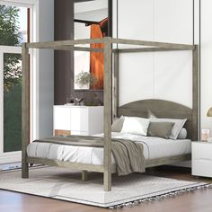 a bedroom with a bed, nightstands and mirror in it's center area