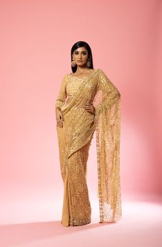 Featuring a golden pre-stitched saree made of pure georgette and net base with intricate hand-embroidery of pearl, sequin, cutdana beads, anchor thread, glass beads all over blouse and saree. Royal Blue Lehenga, Ruffle Lehenga, Stitched Saree, Raw Silk Lehenga, Yellow Lehenga, Ivory Blouse, Blue Lehenga, Drape Saree, Gold Blouse