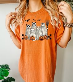 Ghost Cats t-shirt.Bats Halloween shirt.Cat shirt.Comfort Colors Halloween Shirt.Ghost cat with broom shirt.Spooky Season tee.Pumpkin tshirt Comfort Colors® Retro American Mama t-shirt. 4th July tee. Gift for American Mom. Vintage USA top. Freedom t-shirt for her. Gift for her.  Comfort Colors 1717 garment-dyed t-shirt  Item Details::.. - Fully customizable tee made 100% with ring-spun cotton. The soft-washed, garment-dyed fabric brings extra coziness to your wardrobe while the relaxed fit makes Short Sleeve T-shirt With Cat Print For Halloween, Spooky Cat Print Crew Neck T-shirt, Halloween Cat Design Graphic Tee, Halloween Graphic Tee With Cat Design, Spooky Cotton Tops With Cat Design, Spooky Cotton Top With Cat Design, Halloween Cat Print Graphic Tee, Halloween Cat Print Crew Neck T-shirt, Casual Halloween Cat Design T-shirt