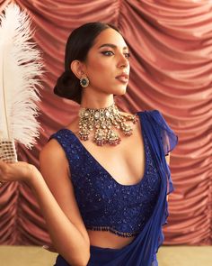 Step into refined elegance with this electric blue embellished choli, intricately adorned for a touch of glamour. Paired with a pre-draped ruffle sari, this ensemble effortlessly blends traditional charm with modern flair, perfect for making a statement at any celebration. Ruffle Saree, Vacuum Storage, Cascading Ruffles, Ready To Wear Saree, Indian Wedding Wear, Sleeves Blouse, Wear Saree, Cocktail Parties, Blouse Length