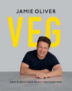 a man sitting at a table in front of a book cover with the title vega