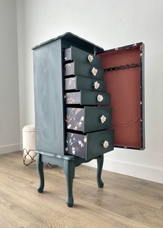 an old dresser with drawers is sitting on the floor