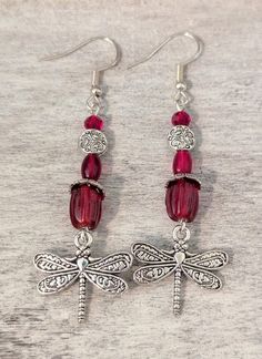 October "Tourmaline" just added!! Whimsical ** "birthstone" ** dragonfly charm earrings Each version is lovingly crafted with silver plated ear wires, beads, bead caps and Art Nouveau style dragonfly charms 🤗 Current variations are as follows: January: "Garnet" features pressed glass beads and faceted beads in rich dark maroon red February: "Amethyst" features sugilite stone beads, purple glass beads and glass pearls  March: "Aquamarine" features light blue sea sediment imperial jasper & glass Whimsical Silver Earrings For Gift, Nickel-free Adjustable Dragonfly Jewelry, Silver Dragonfly Earrings For Gift, Silver Dragonfly Earrings Perfect For Gifts, Whimsical Nickel-free Earrings For Gift, Adjustable Crystal Drop Earrings For Gift, Adjustable Drop Crystal Earrings As Gift, Hypoallergenic Dangle Crystal Earrings Gift, Adjustable Silver Crystal Earrings As Gift