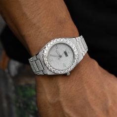 Introducing the Fully Iced Alpha Era® 316, a fully iced-out stainless steel watch featuring over 2,500 hand-set stones throughout the entire piece. The Alpha Era collection is a culmination of our 3-year journey to bring you prestigious, unparalleled timepieces. Alpha Era+ watches are crafted from the finest raw materials and assembled with a custom sweeping movement. You'll feel like an alpha when rocking the newest standard of watchmaking in its most timeless form. *Simple, adjustable sizing f Silver Diamond Watch With Bling, White Gold Cubic Zirconia Bling Watch, Silver Luxury Diamond Watch With Crystal Accents, Luxury Silver Diamond Watch With Crystal, Silver Watch With Rhinestones And Cubic Zirconia, Silver Cubic Zirconia Watch With Rhinestones, Silver Diamond Watch With Rhinestones And Crystal, Silver Stainless Steel Diamond Watch With Diamond Accents, Silver Diamond Accented Stainless Steel Watch