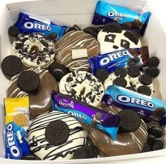 a box filled with oreo cookies and chocolate covered doughnuts