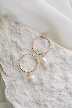 Looking for the perfect high-quality everyday hoops? Our Endless Hoop Earrings are the perfect choice! Made from gold filled metal, these hoops are long lasting and effortlessly stylish. These earrings can be worn alone or paired with a pearl charm for a more sophisticated look. Product Details: 20mm gold-filled hoops Optional add on keshi pearl charms 35mm length with pearls Gold Filled Hoops, Keshi Pearls, Jewelry Photography, Pearl Charms, Cleaning Jewelry, Gold Filled, Hoop Earrings, Gold