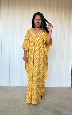 Top Rated Kaftans by Oprah Daily, Byrdi, Cosmopolitan, Elle, and more...  DETAIL  * Bust up to 68 in. * Waist up to 68 in. * Hips up to 68 in. * Arms open up to 22 in.  * Length  55 in. * V neck * Side slits * No pocket * Slipover style * All above measurement are flat FABRIC * 100 % Cotton Printed FIT * One size fit most up to size US 4XL  * Hangs loose and away from the body  * Length can be versatile as a knee length, mid calf length, ankle length  and floor length depending on your style  MO Yellow Kaftan For Beach Cover-up, Summer V-neck Thobe For Beach Cover-up, Printed Tunic Maxi Dress, Flowy Dresses With Kimono Sleeves, Free Size Maxi Thobe For Beach, Flowy Yellow Tunic Maxi Dress, Free-size Maxi Thobe For Beach, Beach Thobe In Free Size Maxi Length, Yellow Printed Beach Cover-up Dress