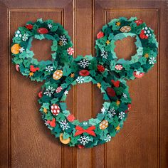 a mickey mouse wreath hanging on the front door