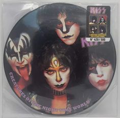 kiss cd cover with the band's faces painted on it