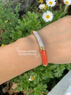 Beautiful cheerful coral diamond 18k solid yellow gold bangle bracelet. The gold has intricate engraved designs while a section of coral displays beautiful Japanese Momo color. Estimated diamond weight is 0.75 carats. Total Weight: 31.71 grams Bracelet length: 6.5 inches Precious Metal: 18k yellow gold Precious stones: -Coral: 28.5mm x 7.2mm -White Round Diamonds: 0.75 carat Hallmark: 750 Luxury Round Coral Jewelry, Elegant Coral Jewelry For Anniversary, Luxury Coral Jewelry For Formal Occasions, Elegant Orange Bangle Jewelry, Elegant Orange Bangle Bracelet, Elegant Orange Gemstone Bracelet, Elegant Orange Wedding Bracelets, Yellow Gold Bangle, Platinum Diamond Rings