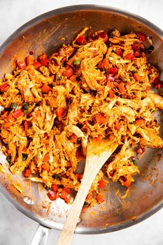 a pan filled with shredded chicken and vegetables