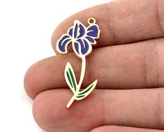 Shape: Flower February Iris Material : Raw Solid Brass  Finish : Shiny gold plated - Enamel filled Size :37x21mm Color : Shiny gold Month flowers, also known as birth flowers, are specific flowers that are traditionally associated with each month of the year. Similar to birthstones, birth flowers have symbolic meanings and are often used to represent the qualities and characteristics associated with individuals born in a particular month. These floral associations have cultural and historical ro Gold Flower-shaped Enamel Jewelry, Gold Enamel Flower Jewelry, Flower February, Flowers For Each Month, Symbolic Meanings, Month Flowers, Iris Flowers, Themed Jewelry, Birth Month