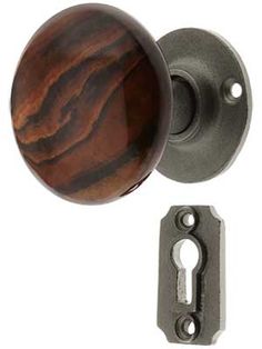 an image of a wooden door handle and keyhole lock on a white background with clippings