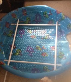 an inflatable baby bath tub with fish and sea creatures on the bottom part