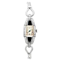 An impressive vintage Art Deco 0.95 carat diamond and black onyx, platinum cocktail watch by 'Hamilton'; part of our diverse antique jewelry and estate jewelry collections. This impressive vintage Art Deco diamond watch has been crafted in platinum. The watch has a rectangular dial with plain black Arabic hour numerals displayed within rectangular designs, the outer one marked as the chapter ring. The Art Deco watch is fitted with shaped, blued steel hands, and the face clearly displays the text Cocktail Watch, Art Deco Watch, Art Deco Lady, Art Deco Diamond, Women Wrist Watch, Art Deco Jewelry, Diamond Watch, Plain Black, Vintage Diamond