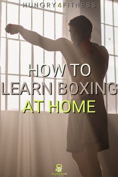 a man standing in front of a window with the words how to learn boxing at home