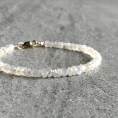 This minimalist Rainbow Moonstone bracelet features small natural gemstones. The semi precious stones are an iridescent white hue with beautiful flashes of blue. It's a versatile, minimalist piece that's sure to become one of your favorites. At checkout, choose a Sterling silver or 14 K Gold Filled clasp. * METAPHYSICAL PROPERTIES OF MOONSTONE * intuition empathy feminine energy peace serendipity transformation Free gift with each crystal jewelry purchase from Gems by Kelley: a beautiful card wi Silver Jewelry Cleaner, Silver Jewelry Diy, Aquamarine Bracelet, Crystal Healing Bracelets, Aquamarine Jewelry, Moonstone Bracelet, Silver Gemstone Jewelry, Leaf Jewelry, Moonstone Jewelry