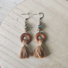 Gorgeous Bronze Boho Dangle Earrings. Wood, Tassels And Burnished Beads Add To Chic Design. Very Lightweight. Neutral Color Go With Most Outfits. 3.15 Inches Long Next Day Shipping Brown Round Bead Earrings For The Beach, Brown Round Beaded Earrings For Beach, Brown Round Beads Earrings For Beach, Brown Beaded Earrings For Beach, Adjustable Brown Bohemian Tassel Earrings, Beach Jewelry With Brown Tassels, Bohemian Brown Beaded Nickel-free Earrings, Brown Dangle Earrings With Tassels, Nickel-free Brown Bohemian Earrings