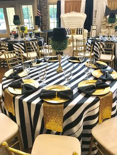 black and white striped table cloth with gold trimmings at a banquet or wedding