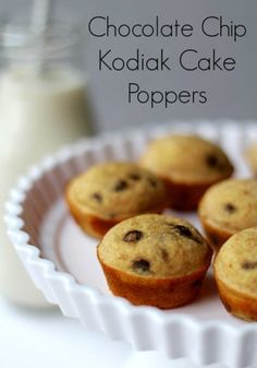 chocolate chip kodiak cake poppers on a white plate next to a bottle of milk