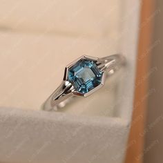 This ring features a 6*6mm asscher cut london blue topaz and sterling silver finished with rhodium. Customization is available. It is made by hand, and it will take about 7 days to finish the ring after your payment is completed. Any question, just let me know. :) My shop homepage: https://www.etsy.com/shop/LuoJewelry?ref=l2-shopheader-name Luo Jewelry, Emerald Cut Solitaire Ring, Wholesale Jewelry Supplies, Mystic Topaz Ring, Pear Cut Engagement Rings, Ring Rosegold, Birthstone Rings, Zierlicher Ring, Cushion Cut Ring