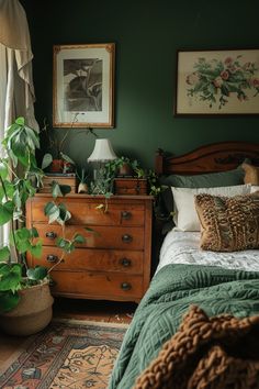 a bedroom with a bed, dresser and potted plants on the side table in front of it