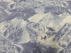 an aerial view of snow covered mountains