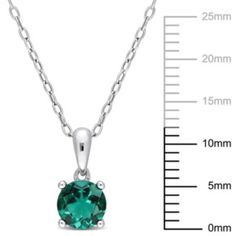 This glazing solitaire created emerald pendant captivates the stunning vibe that a diva requires. Crafted in sterling silver it showcases a round-cut, created emerald gemstone as the center stone in a 4 prong setting for a bold and stylish look. With a high polished finish, this pendant is suspended from an 18-inch round cable chain. Coordinate this versatile necklace with any ensemble from business casual to everyday wear. | Belk & Co Lab Created Created Emerald Solitaire Classic Basket Setting Formal Sterling Silver Emerald Necklace As Birthstone, Formal Emerald Necklace With Sterling Silver, Fine Jewelry Silver Emerald Necklace With Diamond Cut, Silver Emerald Necklace With Birthstone, Classic Sterling Silver Emerald Necklace With Prong Setting, Classic Silver Emerald Necklace With Brilliant Cut, Sterling Silver Diamond Cut Emerald Pendant Necklace, Silver Emerald Necklace With Prong Setting, Formal Emerald Necklace With Prong Setting In Sterling Silver