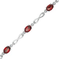 Wrap her wrist in chic style with this remarkable infinity link bracelet. Crafted in sterling silver, this winsome choice features 7.0 x 5.0mm oval-shaped lab-created regal red garnets flanked by round beaded accents. Polished infinity symbol-shaped links complete this alternating design. Buffed to a brilliant luster, this 7.5-inch bracelet secures with a lobster claw clasp. Infinity Symbol Tattoo, Infinity Tattoos, Dragon Tattoo Designs, Celtic Tattoos, Skull Tattoo Design, Handmade Wire Jewelry, Infinity Symbol, Garnet Stone, Red Stone