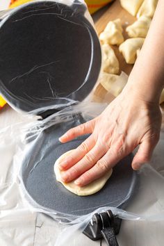 a person is making some food on a table