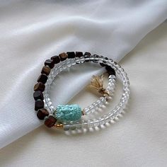 Chinese White Crystal & Chenxiang Wood Beads Bracelet w Turquoise Ganesha Buddha Pendant Crystal Dimension:5.4(mm)0.21(inches)  Wood Dimension:7.7(mm)0.30(inches)  Turquoise Dimension:15.9 x 11.5 x 9.4(mm)0.63 x 0.45 x 0.37(inches)  Check our more items: https://www.etsy.com/shop/QuanRongGallery?ref=seller-platform-mcnav&section_id=17886580&page=2#items Condition: Please look at pictures carefully and judge the condition before bidding.Please do not hesitate to contact me if you have any question with my items or don't understand the condition of the items after reading my listing page. Shipping / Handling Estimate 7-10 business days arrival depending on your location and tracking number will be provided after sending. Please let us know when you received the items by leaving a positive fe Elegant Turquoise Beaded Bracelets For Meditation, Spiritual Turquoise Bracelets With 108 Beads, Turquoise Healing Bracelet With 108 Beads, Wood Bead Bracelet, Buddha Pendant, White Crystal, Beads Bracelet, Ganesha, Wood Beads