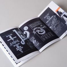 an open book with black and white drawings on it's pages, showing the menus