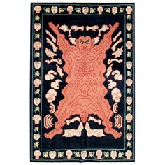 an orange and black rug with designs on it