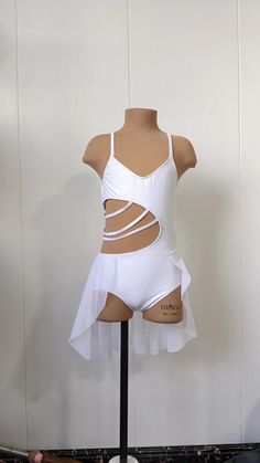 a mannequin wearing a white swimsuit with cutouts on the bottom and sides