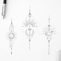 three sun and moon tattoos on a white paper next to a pen, ink drawing