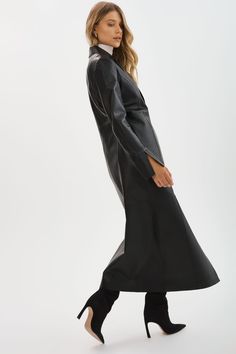 Step out in style with the Evanna Leather Maxi Coat. This single-breasted coat features lateral side slits, clean lines and minimalist details. Whether you're heading to a formal event or simply want to elevate your everyday look, the Evanna Leather Maxi Coat is the perfect choice. Minimalist Details, Maxi Coat, Single Breasted Coat, Black Coat, Clean Lines, Everyday Look, Formal Event, Single Breasted, In Style