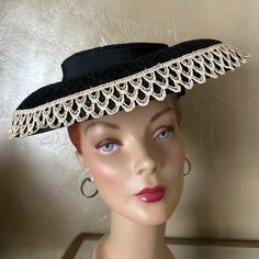 This Is A Most Stunning Example Of The Elegant Millinery Fashions Of The Extravagant 1950s'! This Has Is Made Of A Stiff Black, See-Through Lace With The Appearance Of Straw. The Small Round Crown Is Surrounded By A Black Grosgrain Band That Ends In A Small Streamer At One Side. The Wide Brim Is Edged In An Off White Lace Band. Underneath The Crown There Is A Cap To Hold The Hat In Place, Which Was Typical Of Hats Of This Era. Throughout The 1950s, Ladies Wore Hats Daily As A Part Of Their Attire As Was A Pair Of Gloves. Post War 1940’s And 1950’s Saw Many Women Choosing Not To Wear Hats On A Regular Basis. To Preserve Its Market, The Millinery Industry Set About Creating Variety And Ex Lace Pancakes, Lace Bands, Lace Edging, Fashion History, Wide Brimmed, Hats Vintage, White Lace, Straw, Gloves