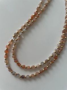 "This sunstone necklace will quite literally add sparkle to any outfit! Reminiscient of it's name, sunstone has flecks of gold in its rich orange color that are brought out even more with the gold filled beads that flank each stone Sunstone is known as the summer stone, reconnecting its wearer with the restorative nature of the sun and channeling joy and enthusiasm 17\" length so will lay perfectly either below a standard 16\" chain or above an 18\" chain for layering The gold filled findings ar Sunstone Necklace, Sunstone Jewelry, Orange Stone, Organza Gift Bags, Necklace Gold, Stone Necklace, Stone Jewelry, Gemstone Necklace, Orange Color