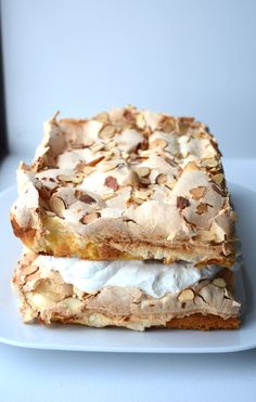 two pieces of dessert sitting on top of a white plate